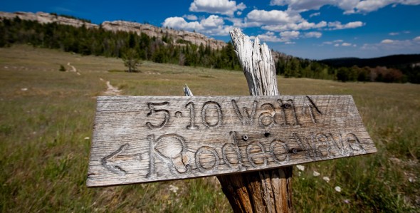 Signage, Main Cliff in background. At close to 3000m altitude, Wild Iris is perfect as a summer destination when low altitude crags are too hot.