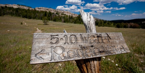 Signage, Main Cliff in background. At close to 3000m altitude, Wild Iris is perfect as a summer destination when low altitude crags are too hot.