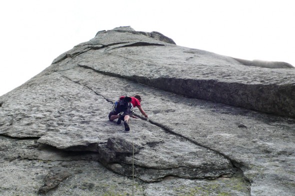 Pitch 1 on The Wedge - fiddling RPs into the seams [photo by Hana]