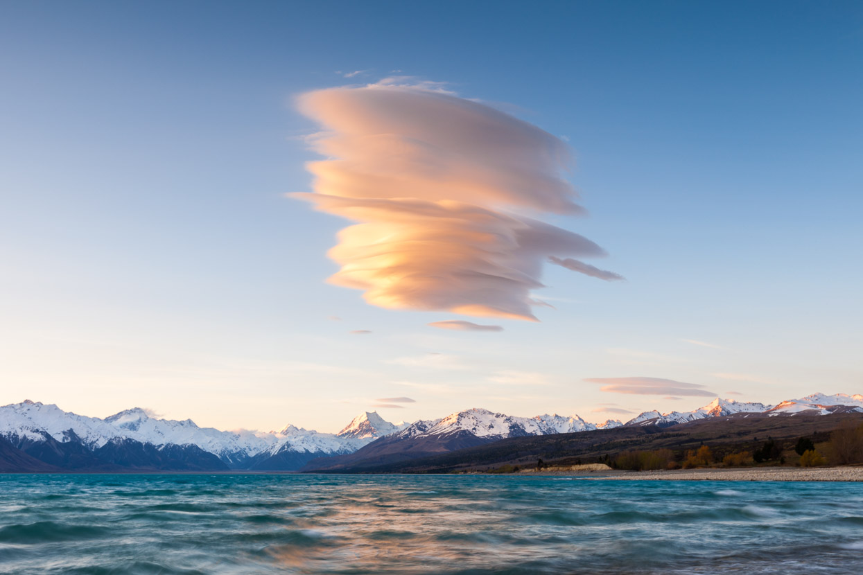 Wind cloud formed over Lake Pukaki, Aoraki Mount Cook and the Southern Alps. Canterbury, New Zealand.