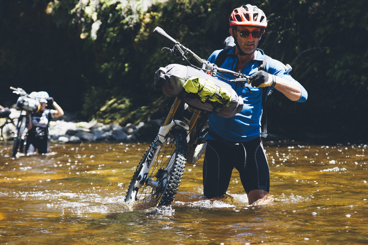 Crossing the Mackley River. This river has a huge catchment areaand consequently floods easily. This was the river we'd decided to give another night to go down after the previous heavy rain and it proved worth the wait: easily crossable and up to about mid-thigh.