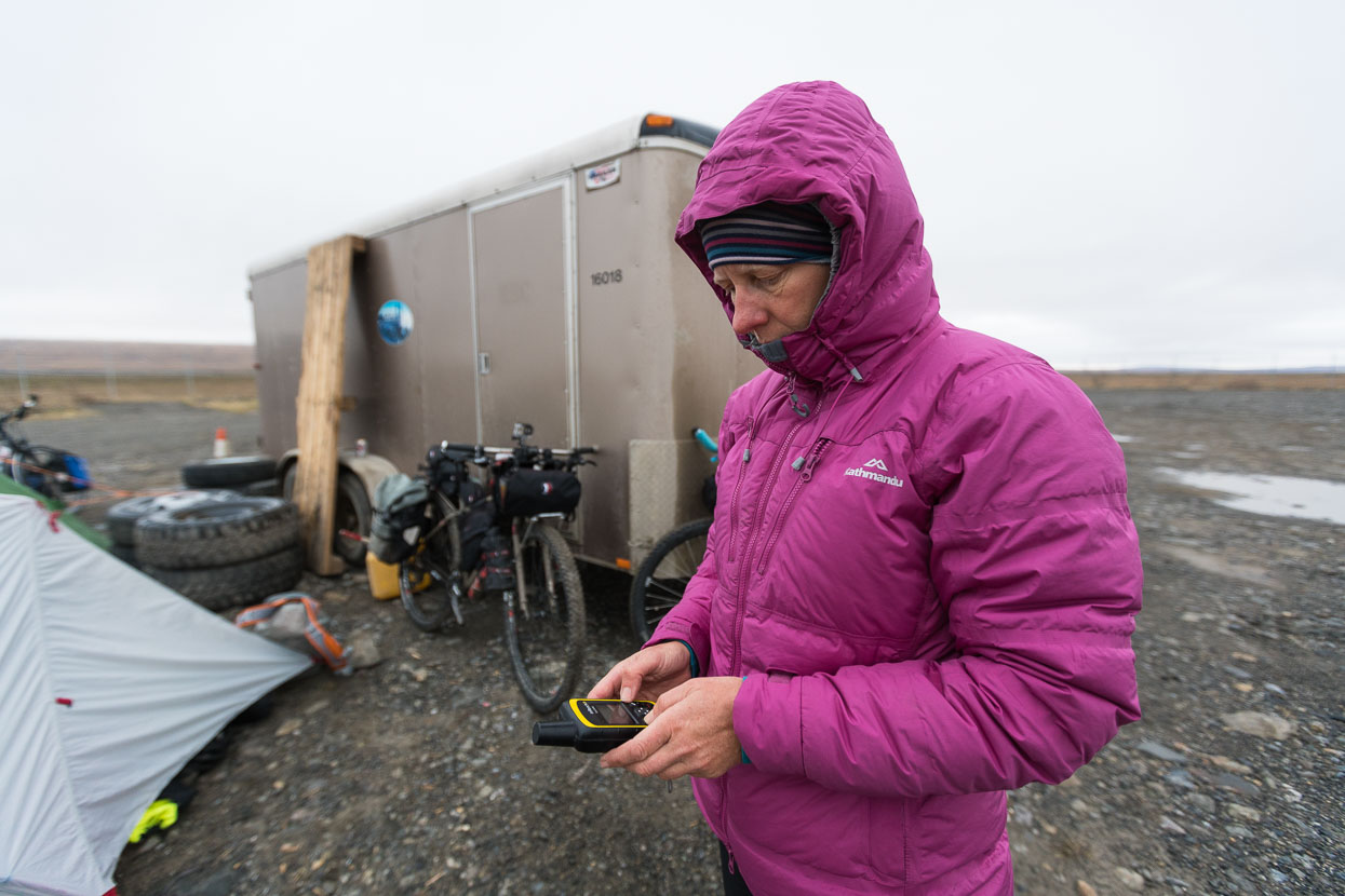 It's hard to find anywhere to get out of the wind the first few days on the road, and at the end of day two we ask permission to camp in the partial shelter of the yard for a service camp that has been set up to accommodate contractors working on fibre optic installation alongside the road. Each night Hana sends out a location 'ping' with out InReach - you can check out our nightly stops here: https://share.delorme.com/markhana