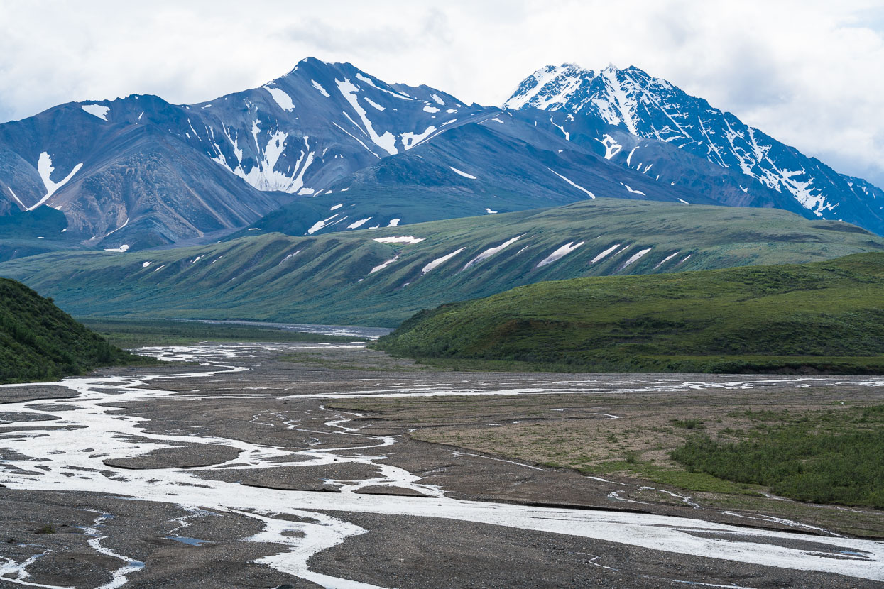 Braids of the Tokalt River East Fork seen from the descent from Sable Pass. The park's complex topography and geology becomes more apparent the further you ride in. The road crosses a number of passes through foothills and mountains as it parallels the heavily glaciated Alaska Range (unfortunately almost entirely behind cloud).