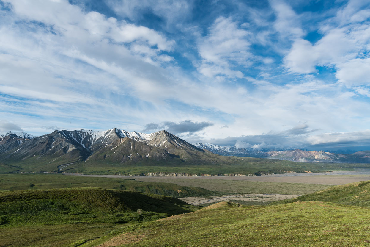 View from the Eilson Visitor Centre, near Thorofare Pass. Toklat River and Denali River valley. Denali hidden in cloud.