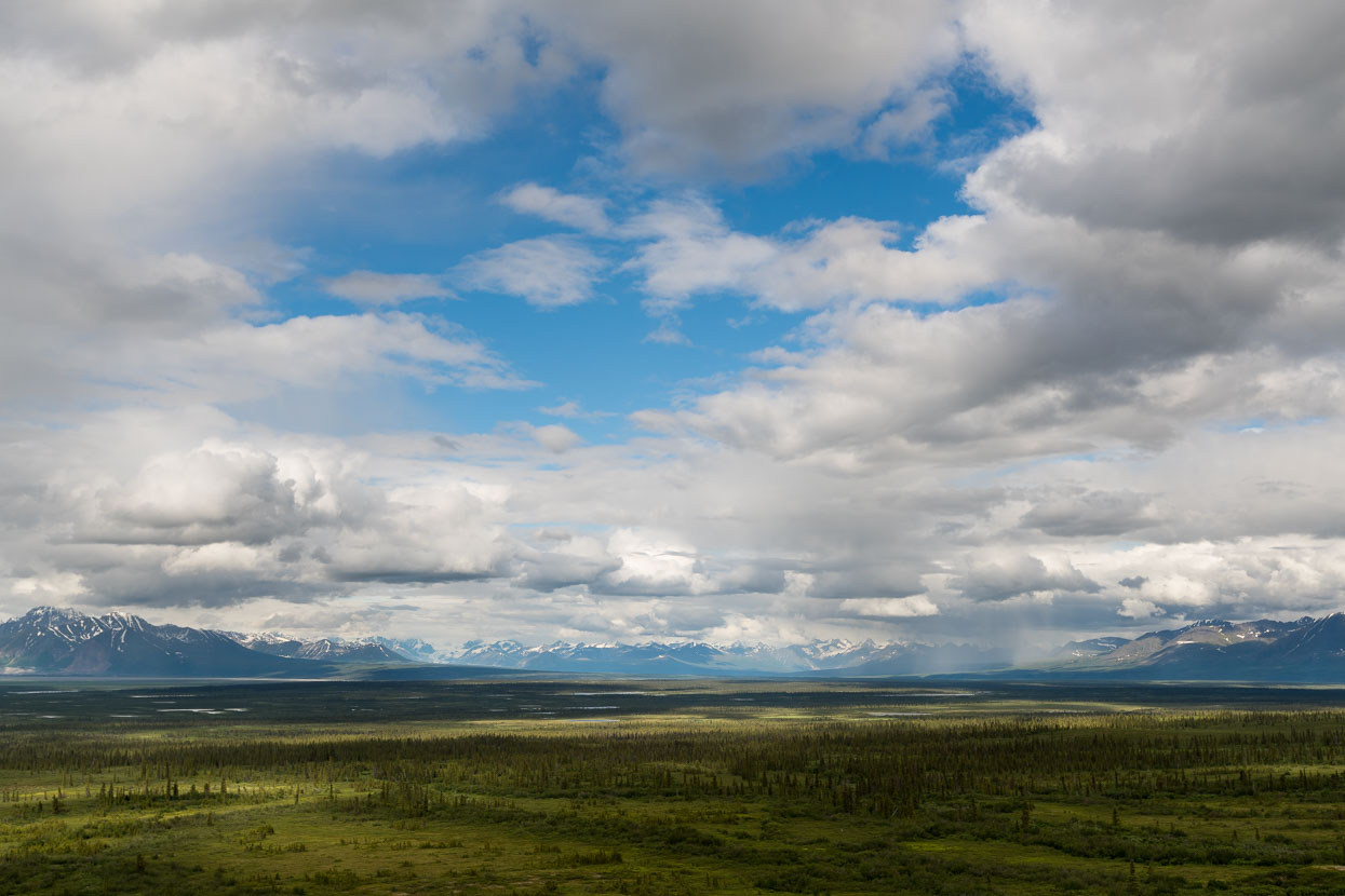 Sweeping views towards the Alaska Range from the high ground followed by the road.