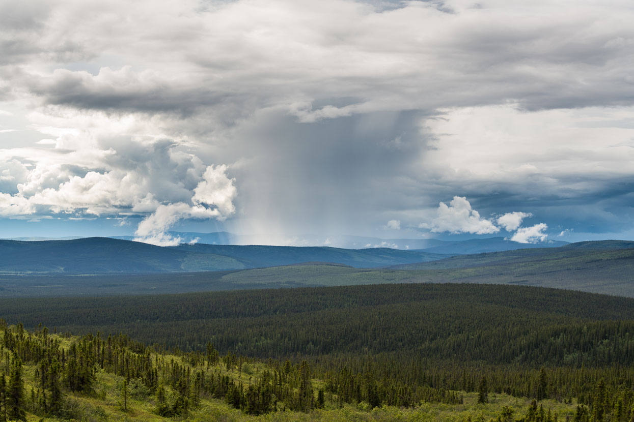 No farms, no other roads, no development: beyond our strip of tarmac boreal forest stretches as far as the eye can see in every direction and distant thunderheads seem to boil in the sky. It's a great, rolling landscape; very similar to the lower reaches of the Dalton Highway and the Elliot before reaching Fairbanks.