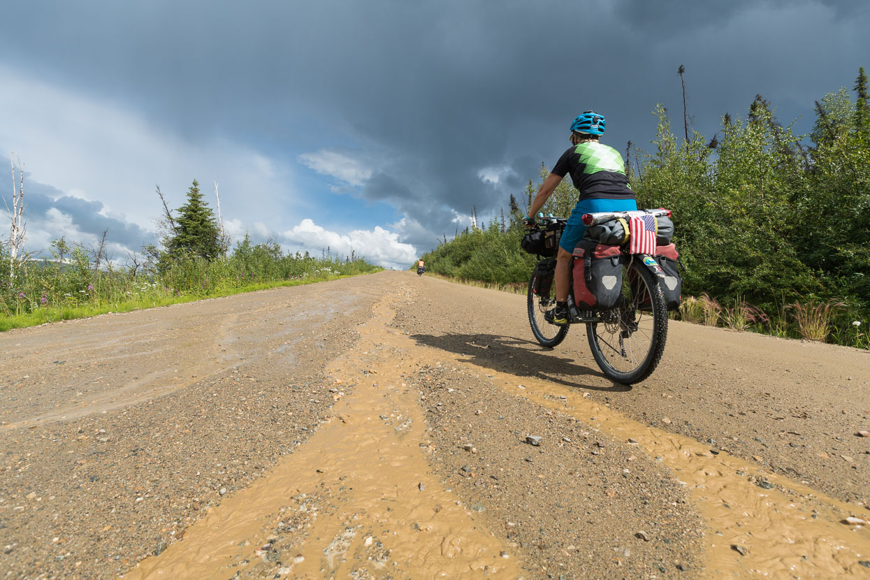 For a time the rain stayed ahead of us, but the road was awash with rivulets from a heavy downpour.