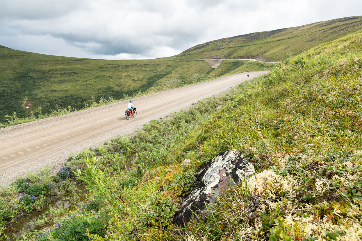 Beyond the border we climb for a while, above the treeline again, on the start of the Top of the World Highway. The road is little used, but in the summer months becomes a rite-of-passage for RV-based tourists driving in the north, and they're pretty much the only traffic we see all afternoon. The first section from the border is the best, with barren, lofty hills and an intense sensation of wide open space. Beyond, the low lying forest closes us into a corridor along the ridgetop in places, but it's still enough for me to be humming a certain Carpenters song, except there are clouds in the sky.