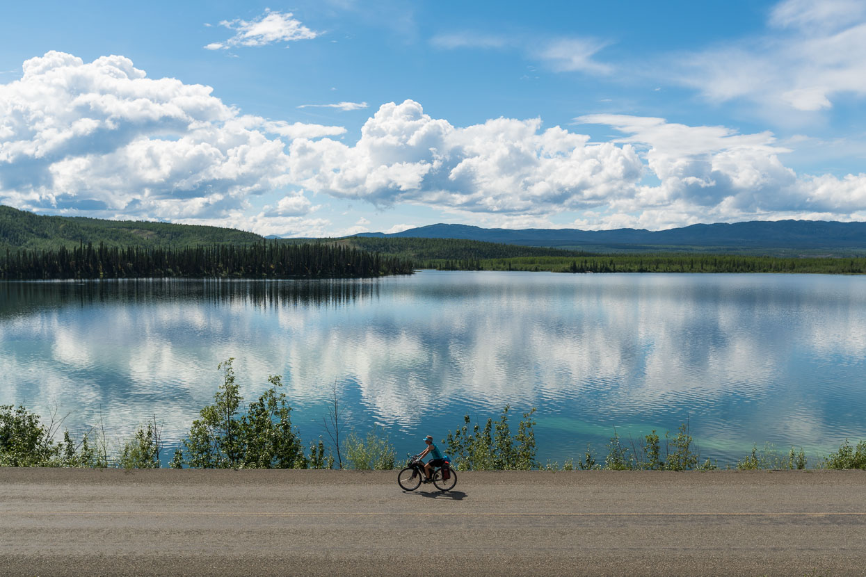 Closer to Whitehorse some pretty lakes finally break the monotony of the view. The flat to rolling ride and hot weather has had us squirming in our seats: even top quality padded shorts and Brooks saddles aren't a panacea when you're sweating all day. Regular application of our Biomaxa chamois cream helps a lot.