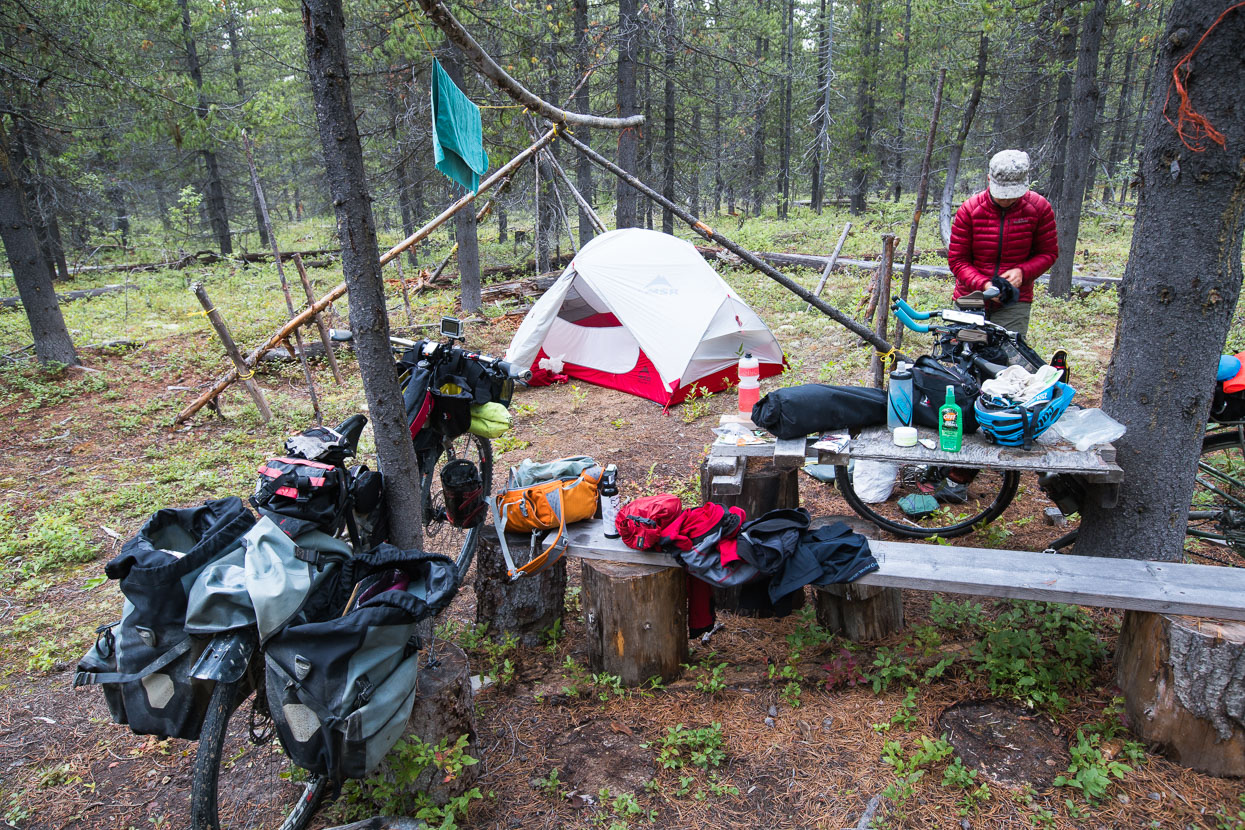 On this evening we'd collected water from a river for the evening camp, but struggled to find a decent site. Eventually we turned off down a clearly private road to try and poach a campsite in the forest. There had been no dwellings for hours and we were sure there was nobody about. A short distance into the forest we found the remains of a First Nations 'replica' camp and settled in for the night.